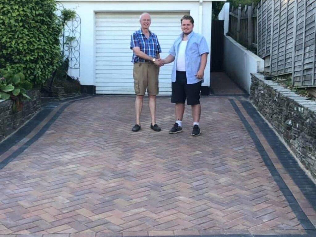 Shaking hands on driveway